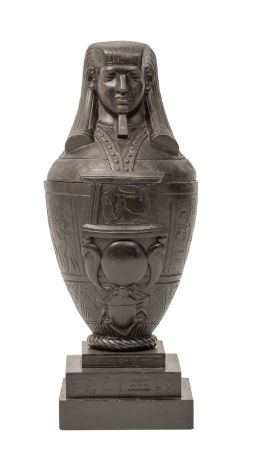1036.  Urna funeraria de metal con forma de momia. S. XIX.