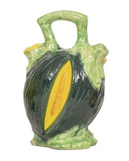 1467.  Jarro de engaño de cerámica esmaltada en forma de melón, con asa.Principios del S. XX.