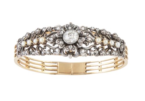 Brazalete rígido S. XIX con centro de flor coronado por bri