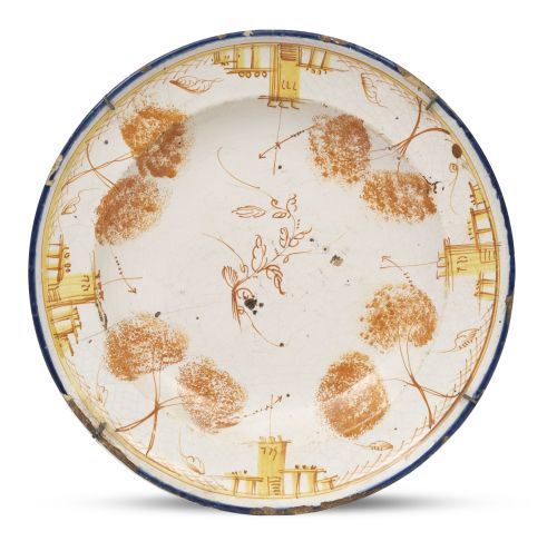 Plato de cerámica esmaltada con arquitecturas y decorado a 