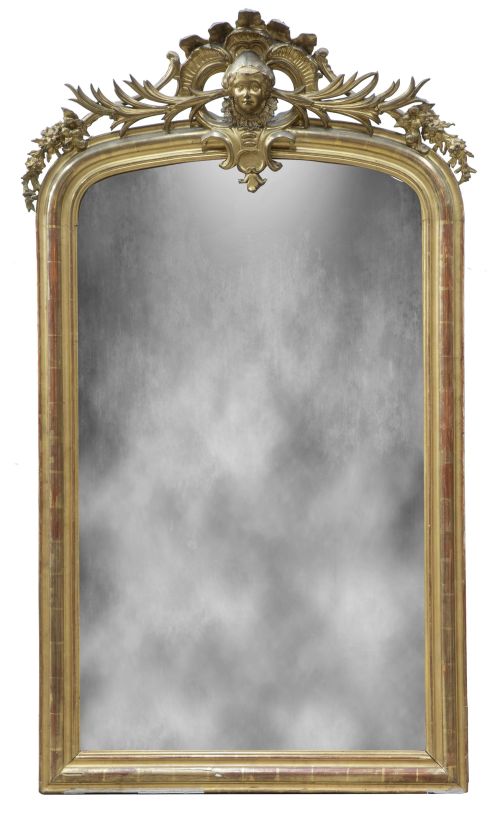 Espejo de madera tallada y dorada con rostro femenino en el