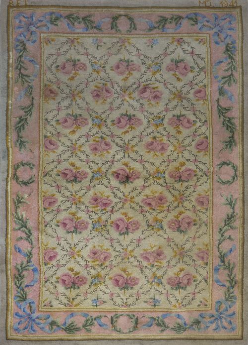 Alfombra en lana de nudo español en beige, rosa, azul.Rea