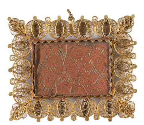 "Santa Teresa de Jesús".Relicario con marco de oro en fil