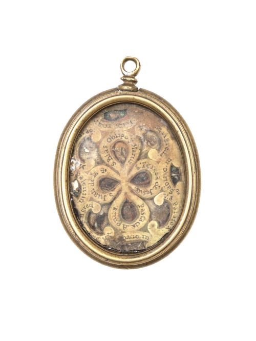 Relicario de dos vitrales con filacterias y marco de bronce