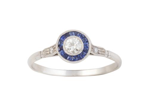 Sortija ojo de perdiz con brillante central de 0,13 ct orla