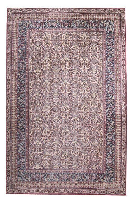 Alfombra en lana de campo granate y decoración geométrica.