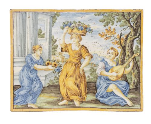 Placa de cerámica esmaltada en verede, azul, ocre, con una 