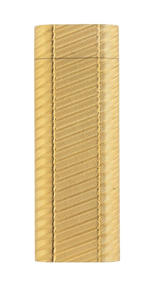 Encendedor CARTIER plaqué or, con decoración de espiga. 497
