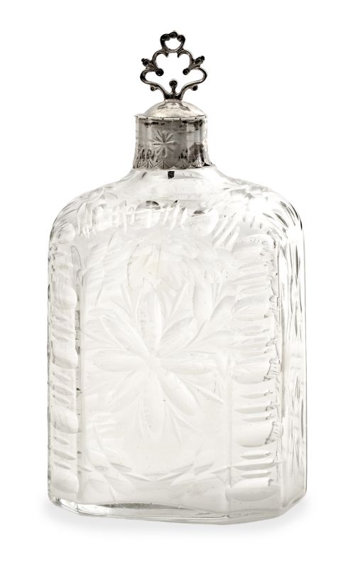 Frasca de vidrio transparente con flores talladas con tapón