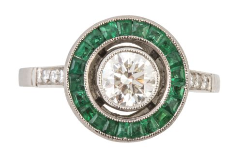 Sortija ojo de perdiz con brillante central de 0,60 ct.orla