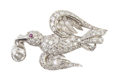Broche con diseño de golondrina cuajado de diamantes con br
