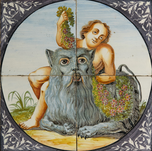 Panel de azulejos esmaltados con el joven Baco con un león.