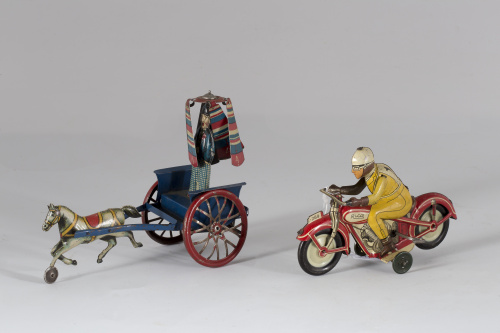 Rico (1910-1948)Antiguo payaso en carro con mecanismo a pa