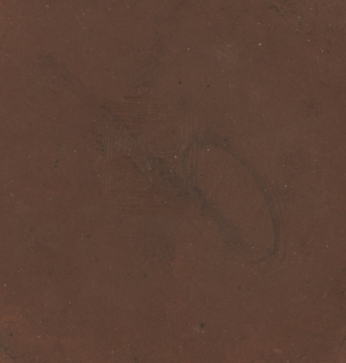 Tetera en barro, rematada en la tapa por una quimera.Traba