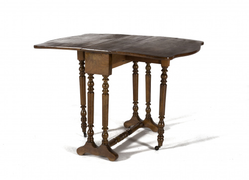 Mesa “sutherland” de madera de nogal, sobre patas torneadas