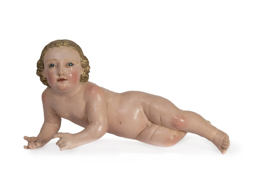 Niño Jesús de madera tallada, policromada y dorada.Círcul