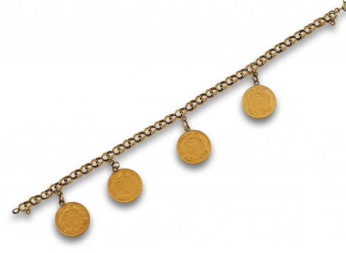 Pulsera de cadena de eslabón barbado en oro de 18K. Con cua