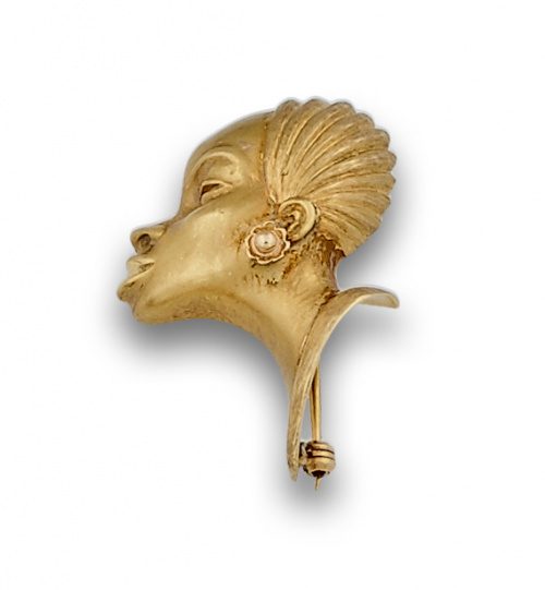 Broche vintage con cabeza de Africana en oro liso y mate de