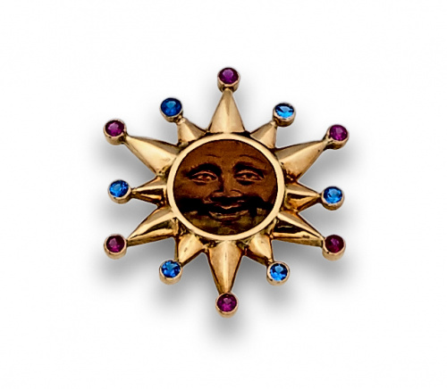 Colgante sol con zafiros y rubíes sintéticos y centro de oj