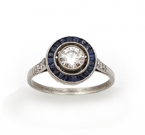 Sortija ojo de perdiz con brillante central de 0,46 ct y or