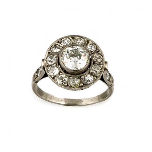 Sortija ojo de perdiz con brillante en chatón central de 0,