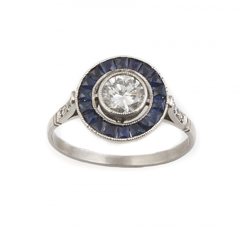 Sortija ojo de perdiz con brillante central de 0,60 ct orla