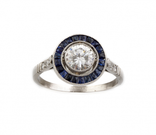 Sortija ojo de perdiz con brillante de 0,84 ct orlado de za