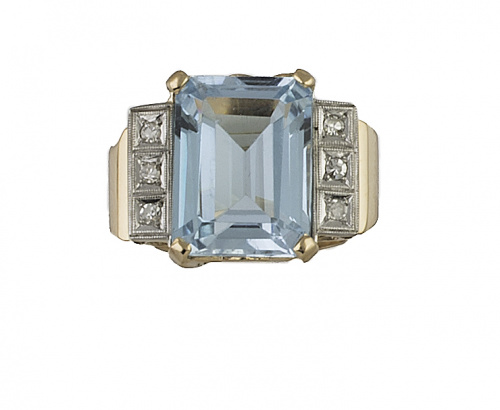 Sortija años 40 con un topacio azul central entre bandas de