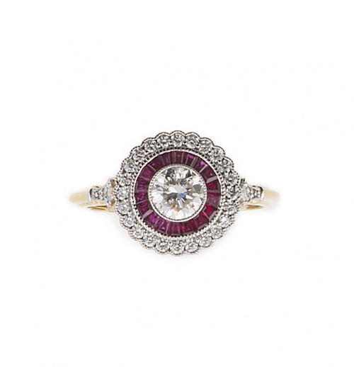 Sortija ojo de perdiz con brillante central de 0,80 ct orla