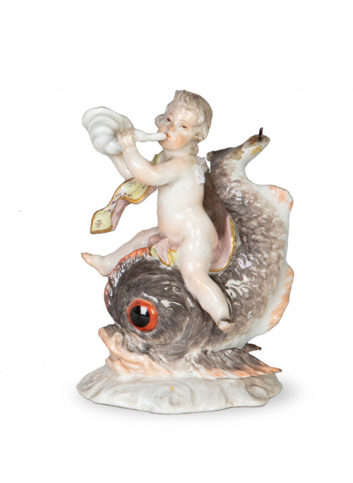 Amorcillo sobre delfin de porcelana esmaltada.S. XVIII.