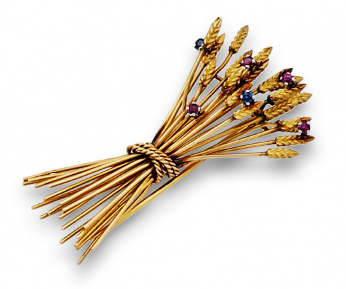 Broche de espigas en oro de 18K con rubíes y zafiros.