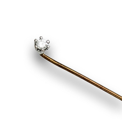 Alfiler con brillante de 0,15 ctes en oro de 18K.