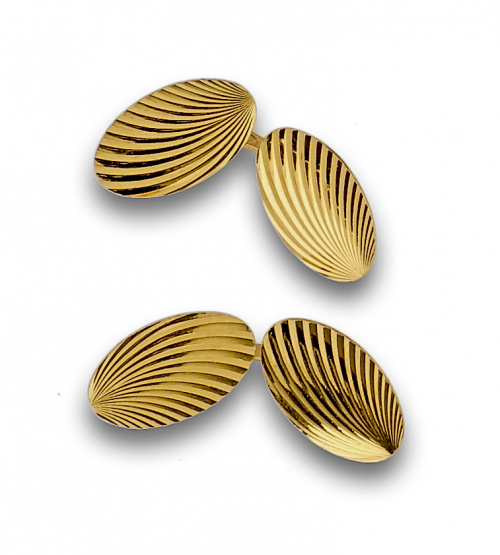 Gemelos dobles ovalados grabados en oro de 18K.