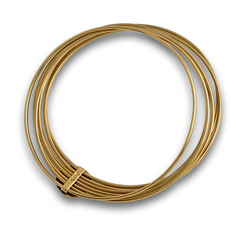 Semanario con siete aros unidos de oro de 18K.