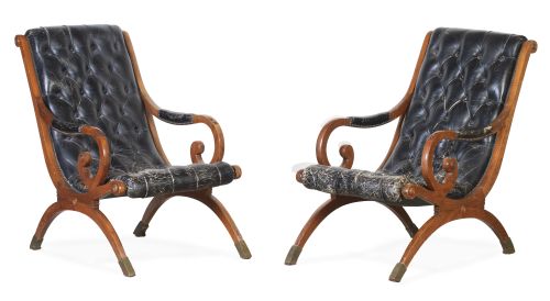 Pareja de butacones en madera nogal tapizados en cuero capi