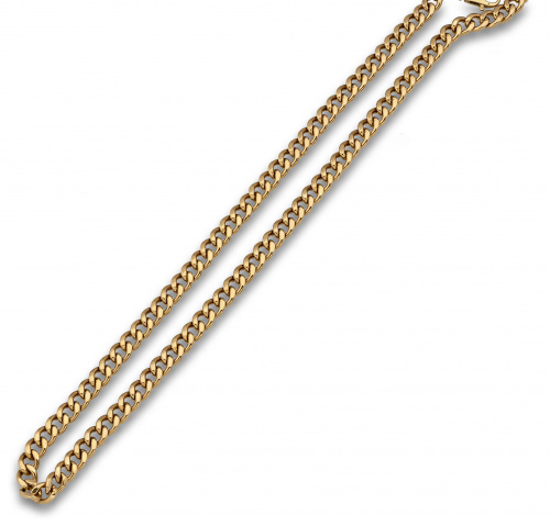 Cadena de eslabón barbado en oro de 18K.