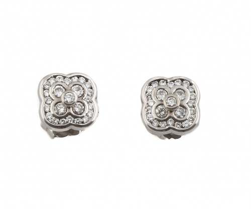 Pendientes con flor de brillantes rodeada por orla de brill