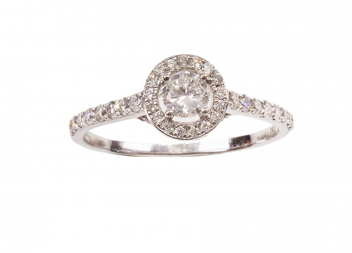 Solitario de 0,22 ct orlado de brillantes y con pequeños br