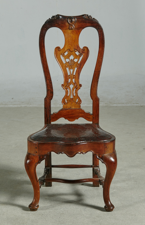 Importante juego de doce sillas de madera de palosanto y as