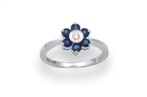 Sortija flor con brillante rodeado de zafiros en oro blanco