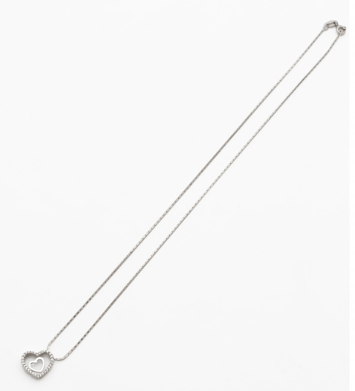 Colgante corazón de brillantes con corazón liso en interior