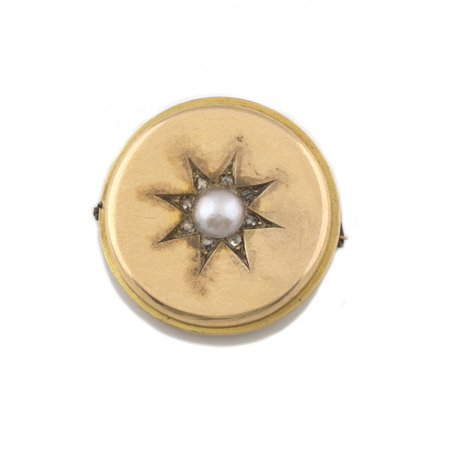 Broche circular de pp s. XX con perla fina central y estrel