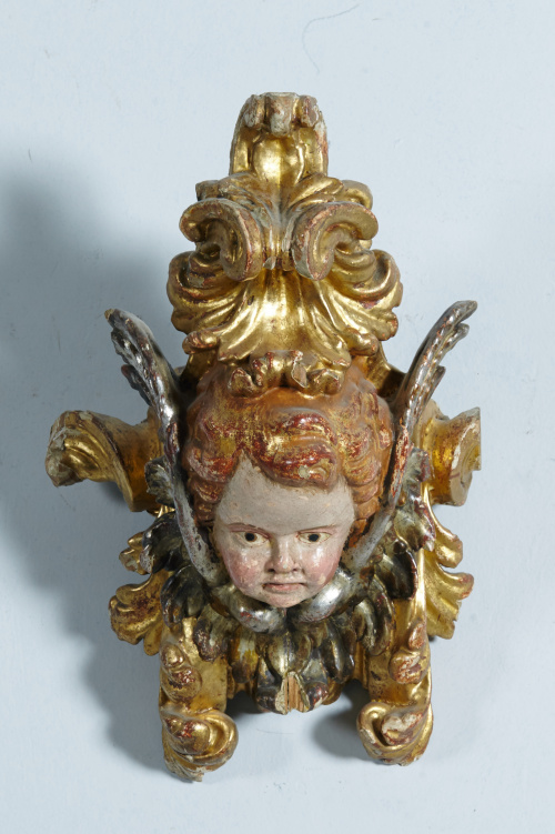 Fragmento de retablo con cabeza de querubín en madera talla