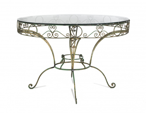 Mesa de comedor ovalada en bronce y tapa de cristal.Ffs. S