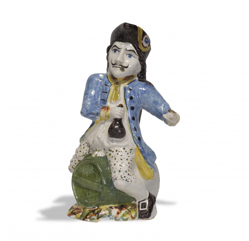 Hombre sobre barril de cerámica esmaltada.Posiblemente por