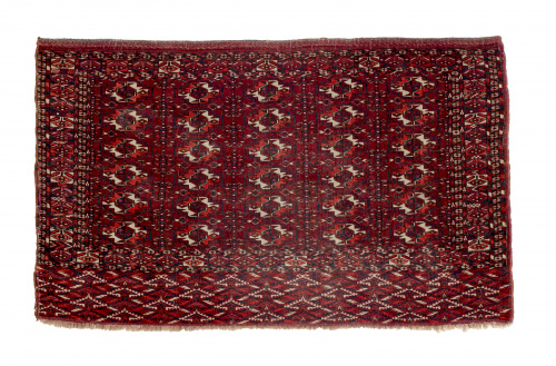 Alfombra en lana de la tribu de los Tekke, con diseño geomé