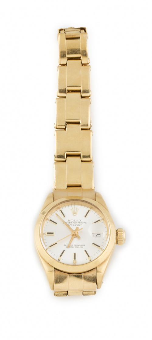Reloj ROLEX oyster perpetual date en oro de 18K.