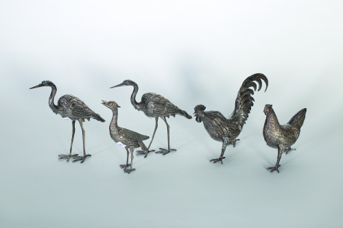 Juego de tres garzas decorativas de plata, pp. del S. XX.