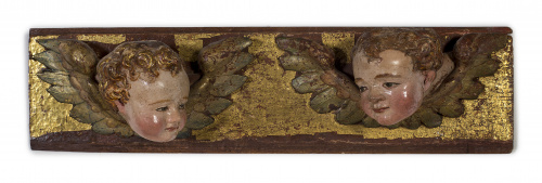 Panel con cabezas de querubines en madera tallada y policro