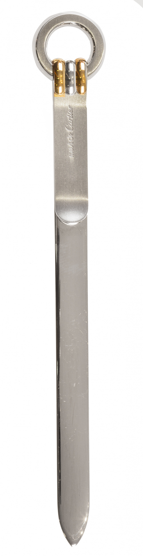 Abrecartas Must de CARTIER en acero dorado y plateado.